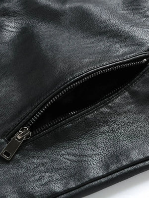 Black plus-size moto jacket detail showing a zippered pocket with silver hardware.