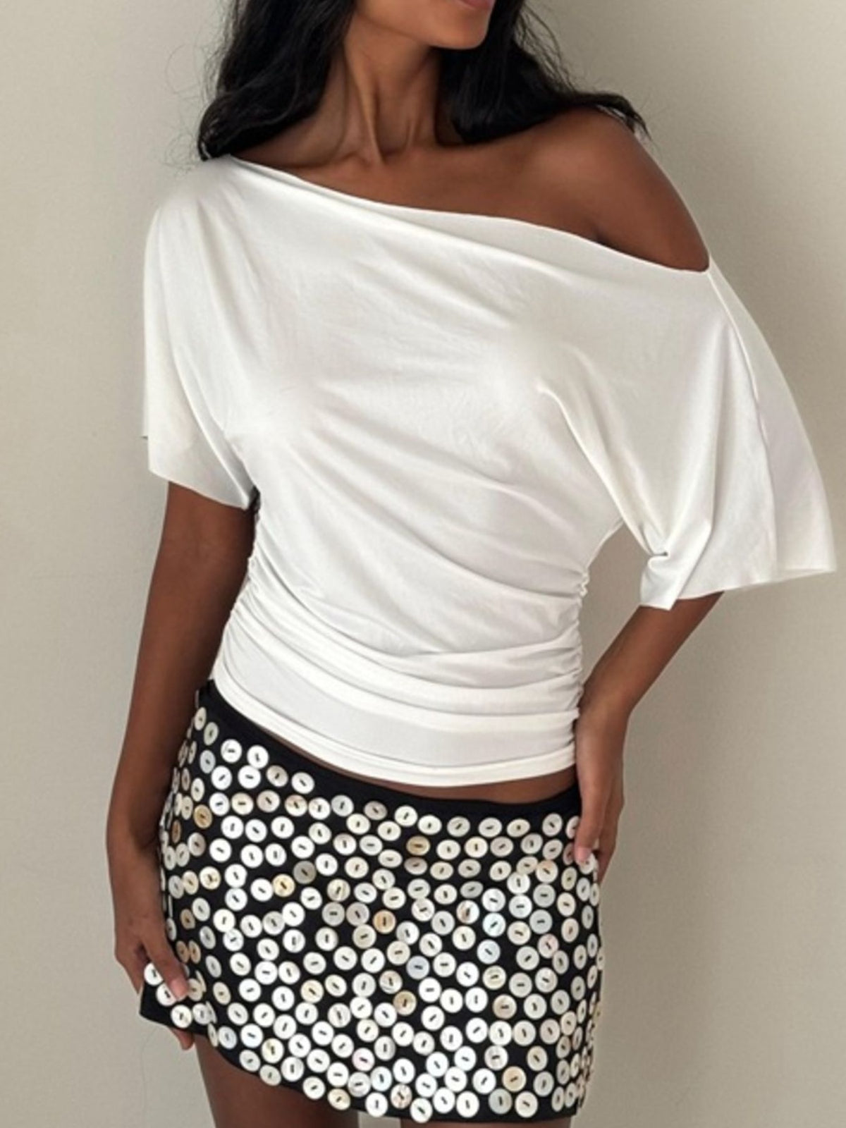 White ruched one shoulder t-shirt with asymmetrical neckline and dolman sleeves.