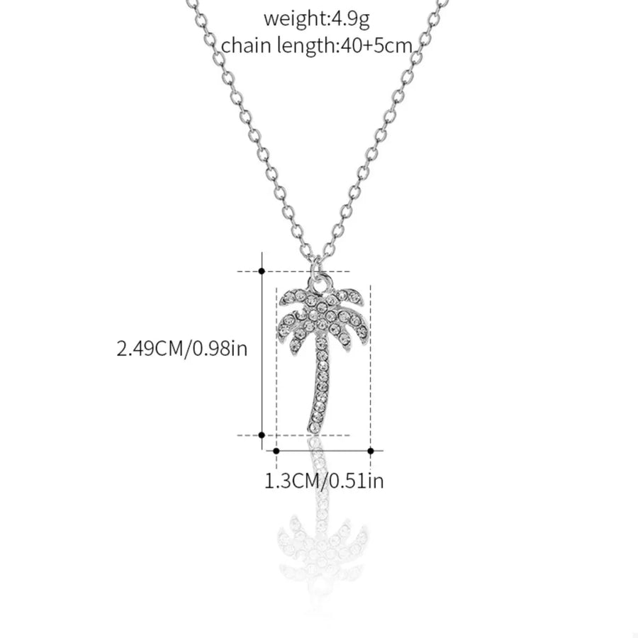 Silver palm tree pendant necklace with clear rhinestones on a delicate chain.