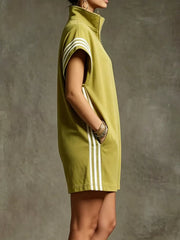Mustard color zip-up romper with white stripes on sleeves and sides, featuring pockets.