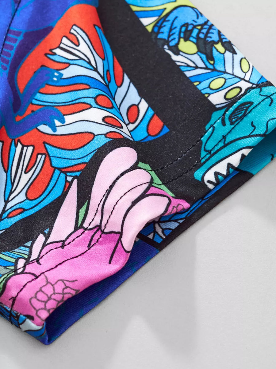 T-shirt with a vibrant abstract floral and dragon print, featuring black trim.