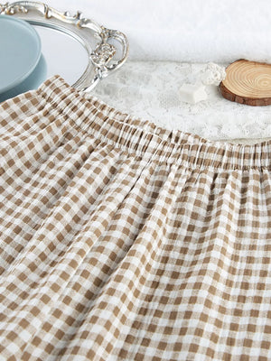 Khaki pajama set with hip-length top, full-length pants and button-front, elastic