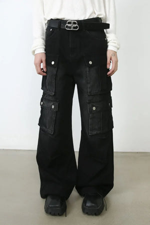 Oversized dark denim cargo pants with multiple pockets and a wide leg.