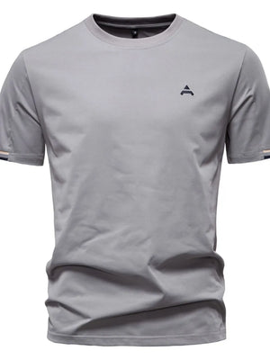 Gray t-shirt with embroidered crest detail and striped sleeve cuffs