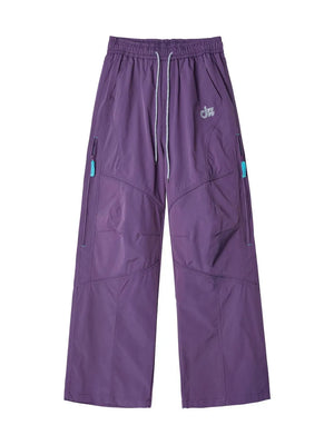 Meadow Purple relaxed fit cargo active pants with drawstring and zippered pockets.
