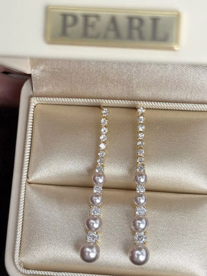 White earrings with below-earlobe and post-back