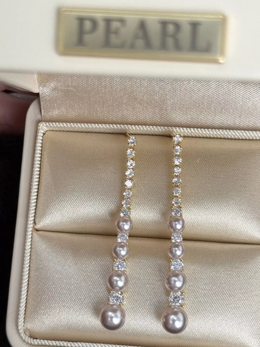 White earrings with below-earlobe and post-back