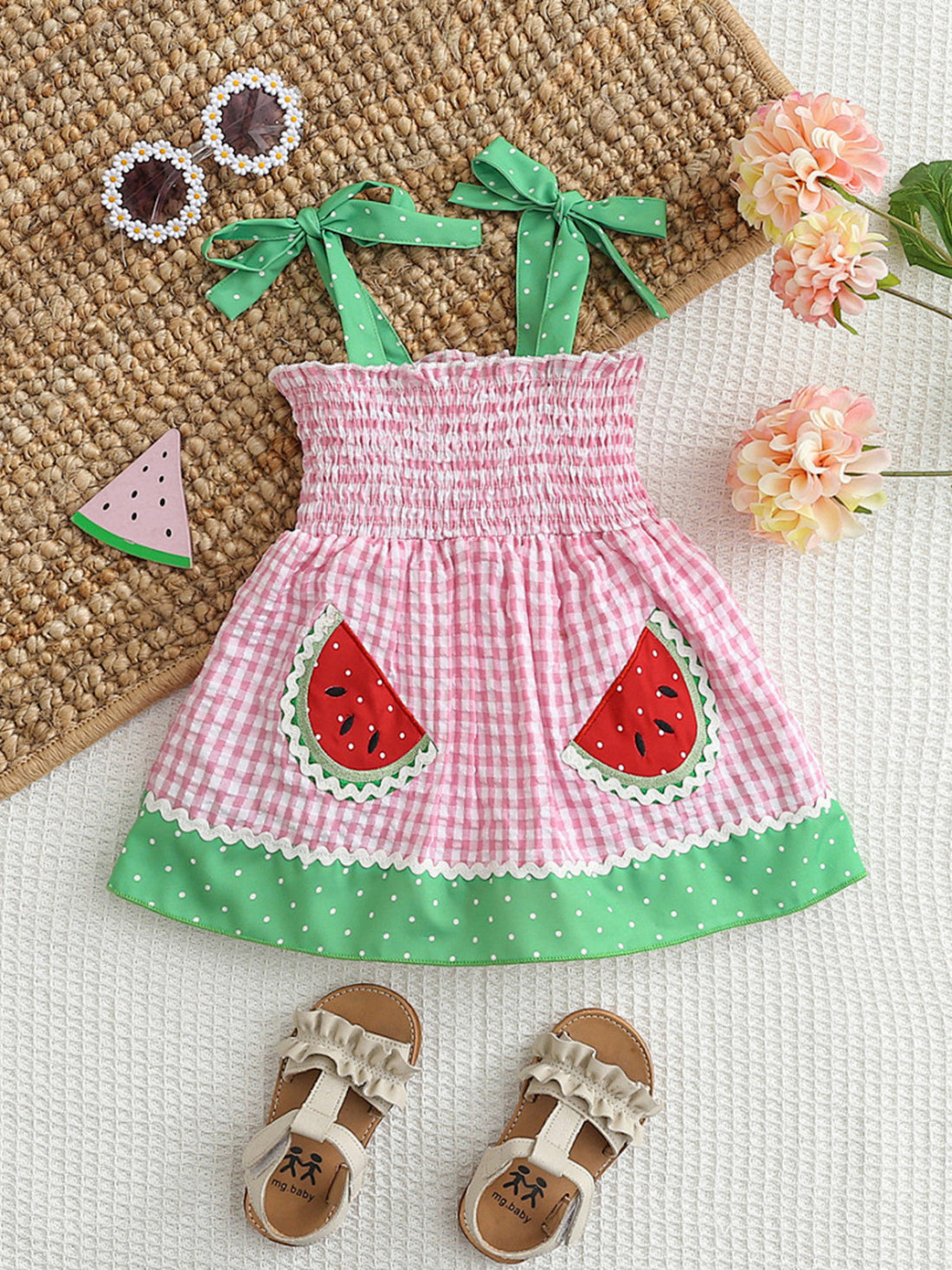 Pink gingham baby dress with smocked bodice, watermelon pockets, and green polka dot trim.