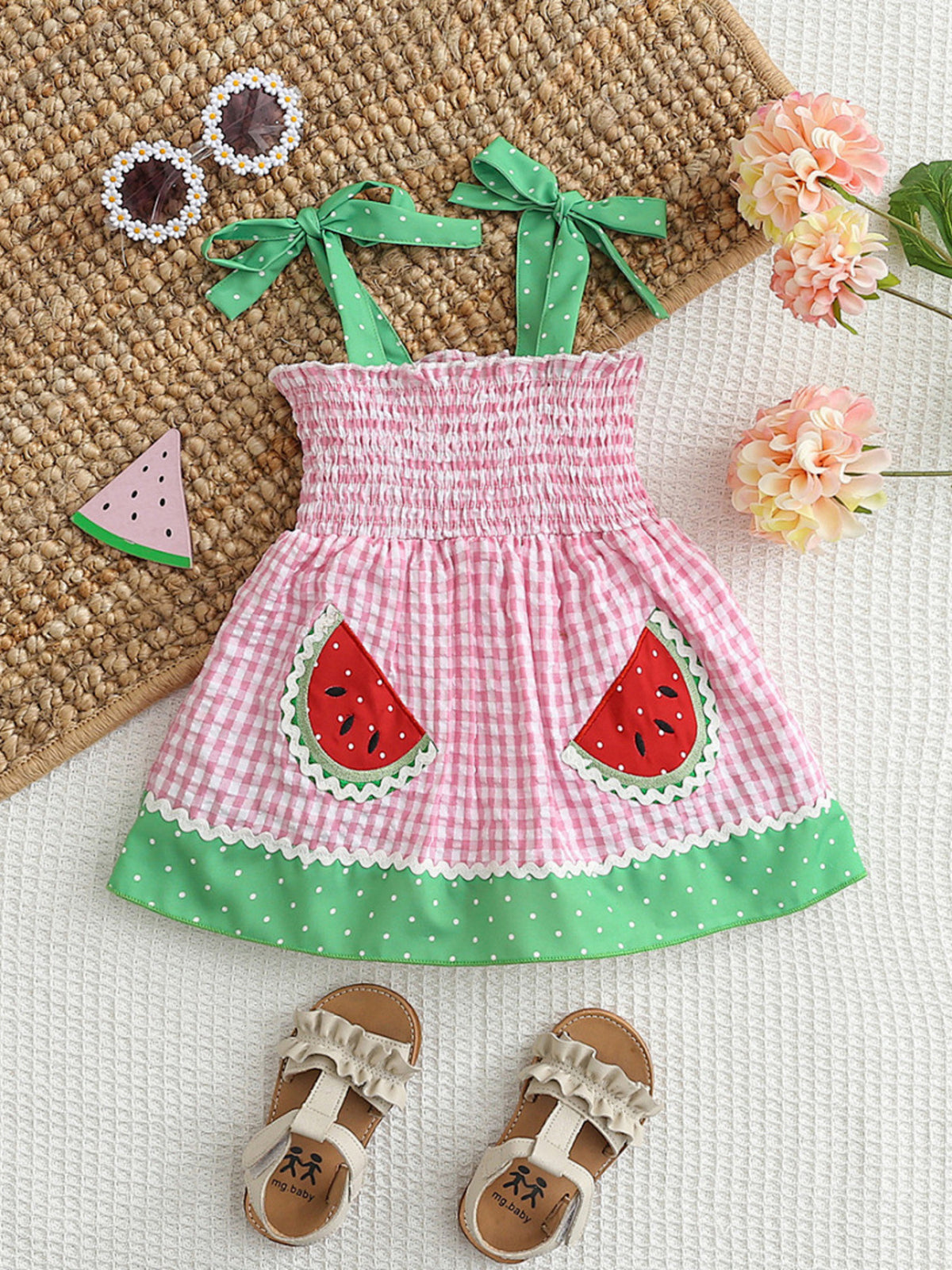 Pink gingham baby dress with smocked bodice, watermelon pockets, and green polka dot trim.
