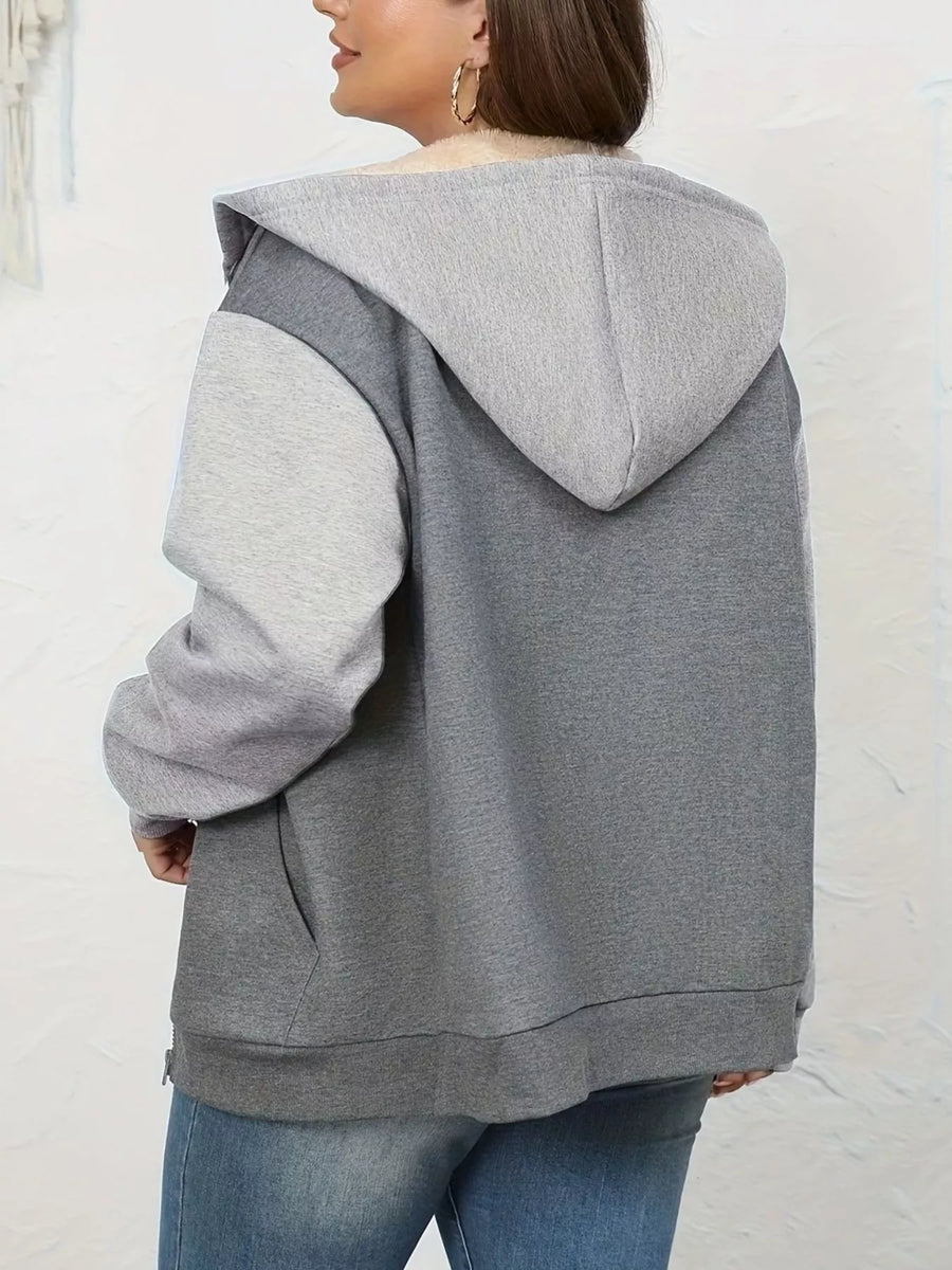 Gray sherpa lined zip-up hoodie with two-tone sleeves and front pocket detail.