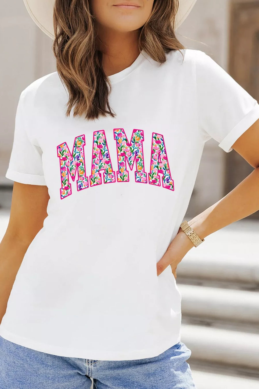 White graphic t-shirt with floral "MAMA" text, crew neck, short sleeves