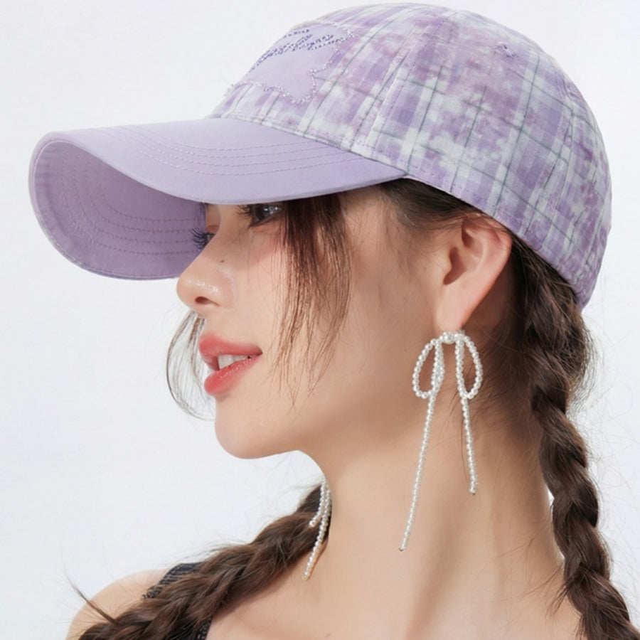 Purple plaid cotton baseball cap with embroidered detail and adjustable strap.