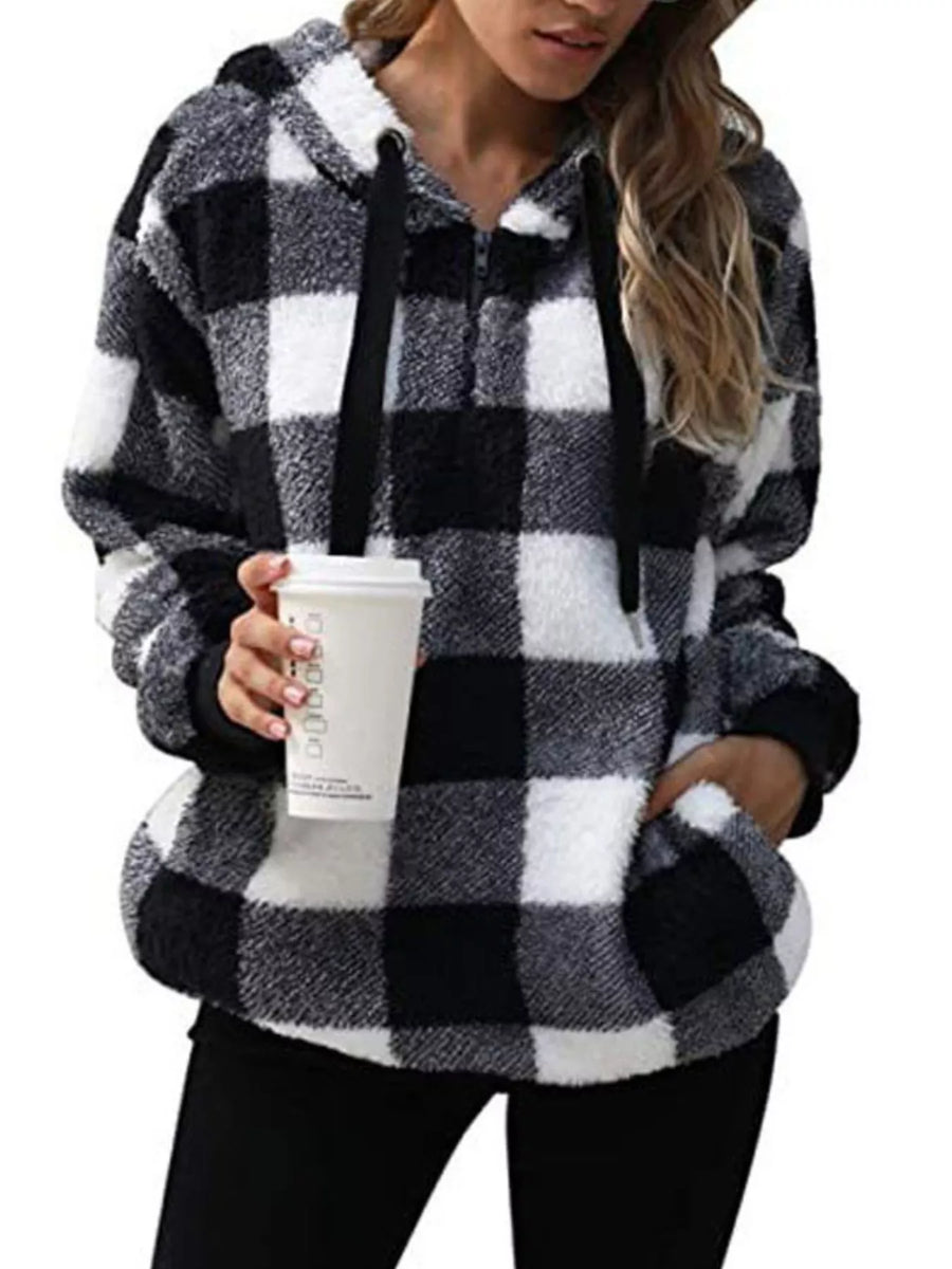 Plaid sherpa drawstring hoodie in black and white with a zipper and pockets.