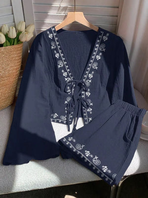 Navy embroidered tie-front top and shorts set with white paisley pattern.