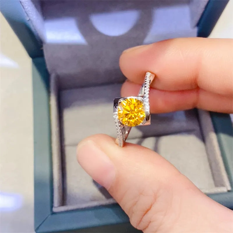 Silver ring with bright yellow diamond and sparkling band detail