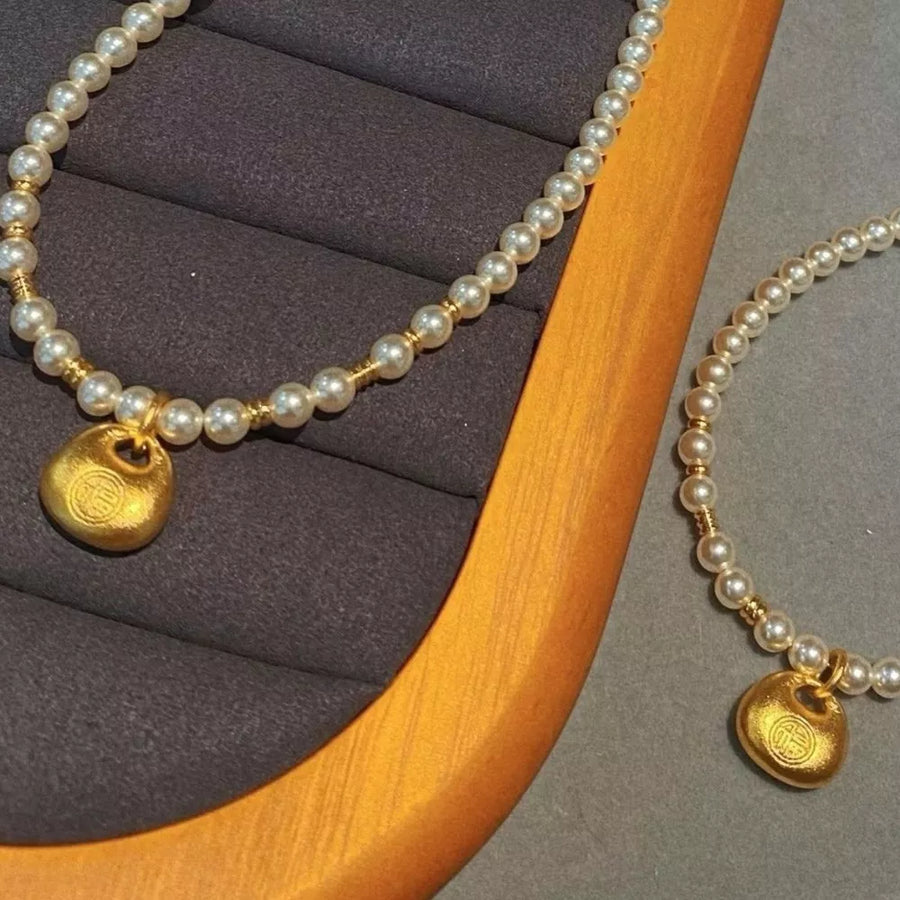 Gold necklace with choker and clasp