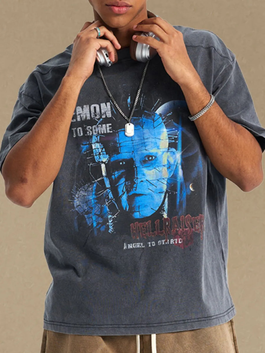 Dark gray relaxed fit tee with a graphic print of Pinhead from Hellraiser.