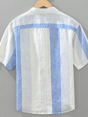 Color block casual short sleeve shirt with blue and white vertical stripes and a horizontal blue stripe across the back yoke.