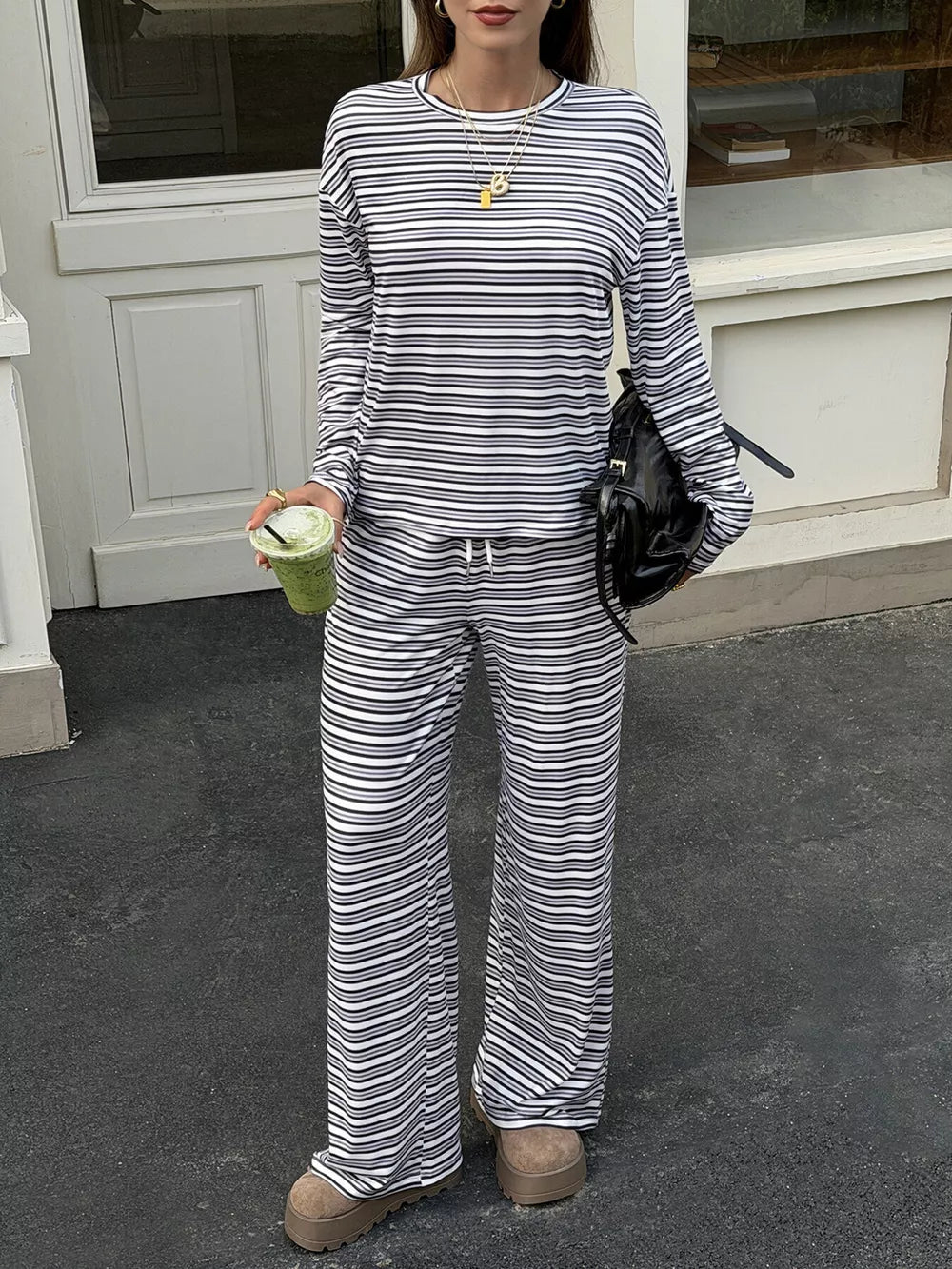 black pajama set with hip-length top, full-length pants and pullover, drawstring, elastic