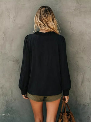 White relaxed blouse with v-neck