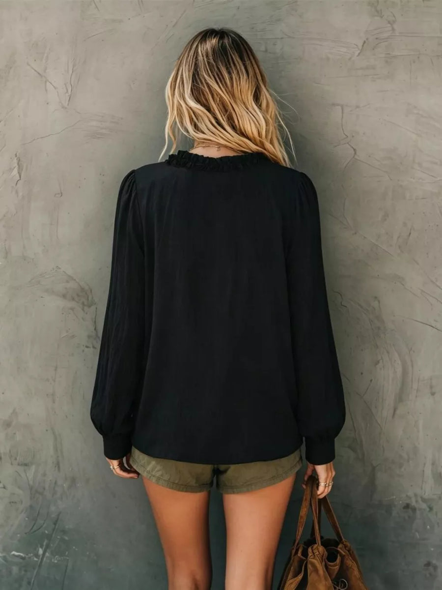White relaxed blouse with v-neck