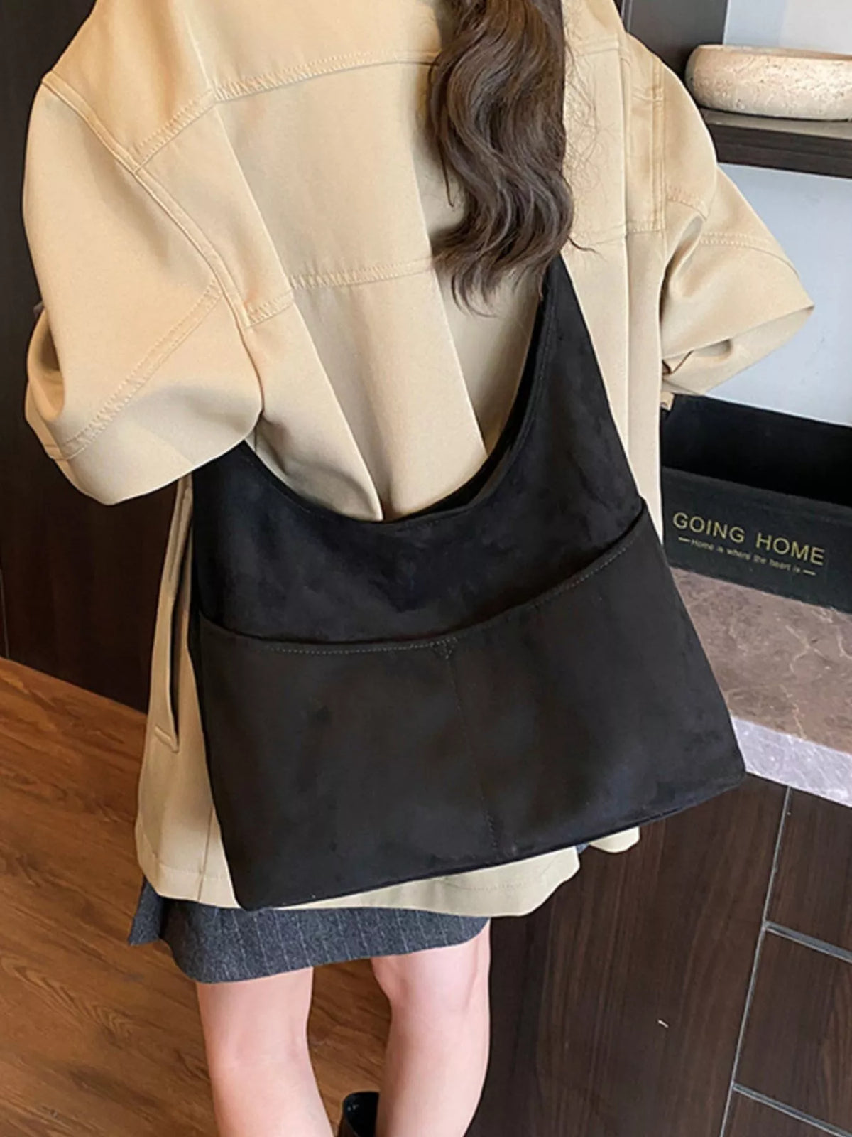 Large black suede shoulder bag with front pocket detail
