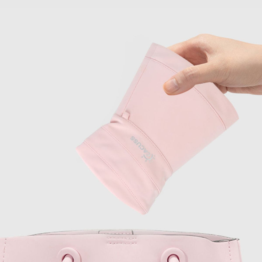 Wide brim sun hat in blush pink, showing UV protection logo detail.
