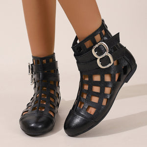 Black ankle boots with cutouts and double buckle straps