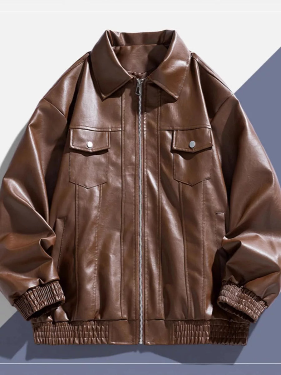 Brown leather zip-up jacket with chest pockets and elastic cuffs