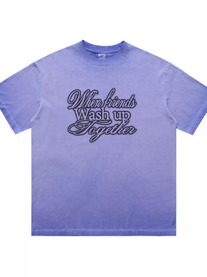 Men's vintage wash graphic tee in blue with crew neck and "When friends Wash up Together" text.