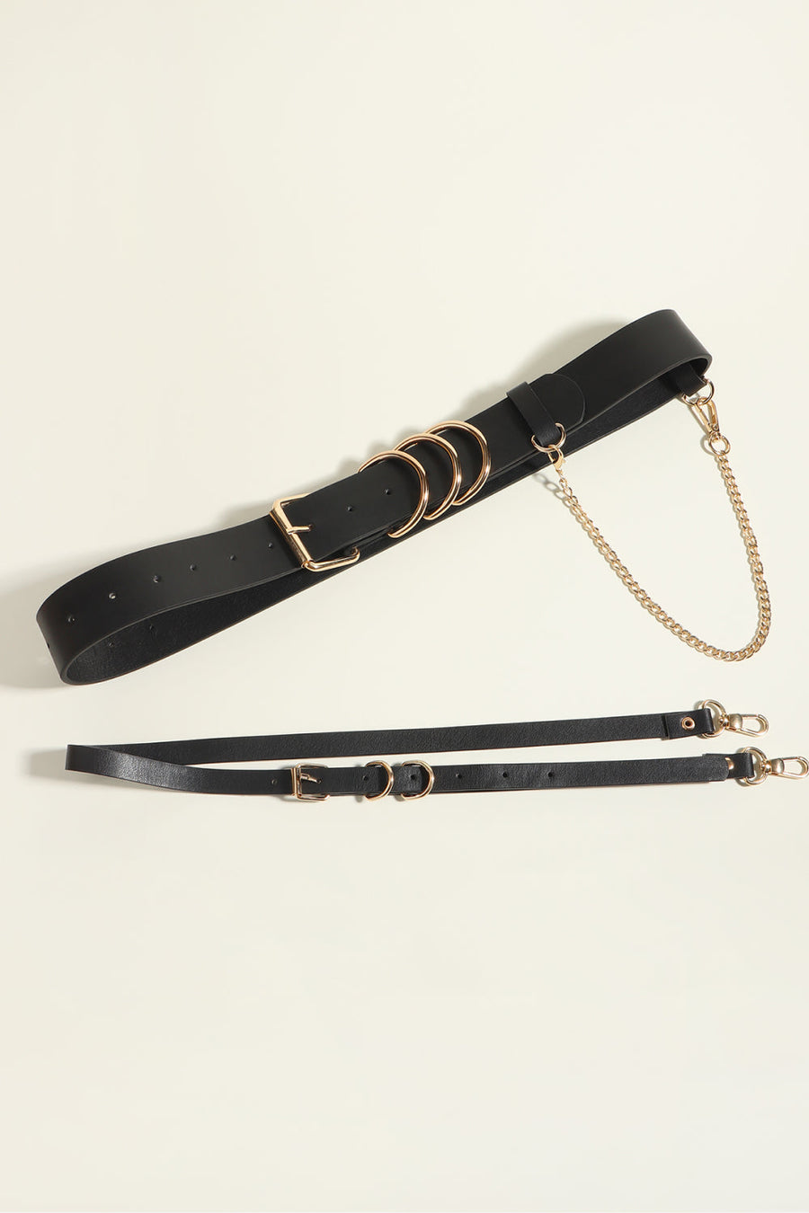 Black PU leather harness belt with gold chain detail and multiple rings.