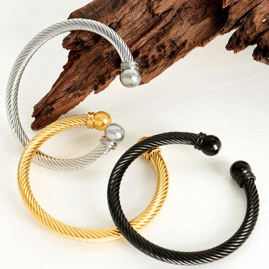 bracelet featuring twisted cable in silver with 18K Gold-Plated,Stainless Steel Care instructions: Avoid wearing during
