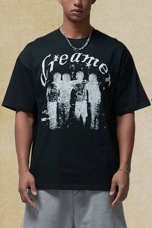 Black oversized graphic tee with white "Dreamer" text and distressed figures.