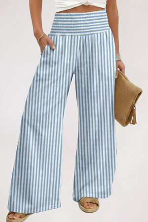 Blue and white striped cotton maternity pants with pockets and smocked waistband.