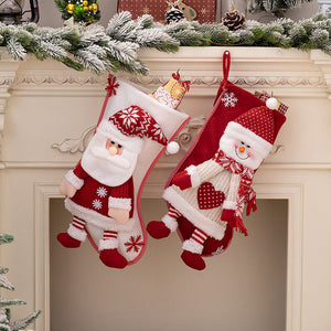 Festive plush Santa and Snowman Christmas stockings with red and white details.