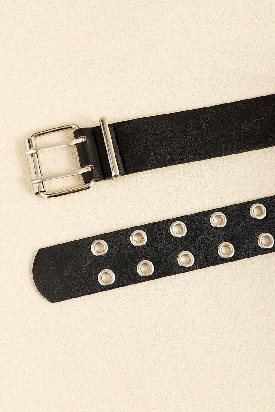 Black double buckle belt with silver eyelets and hardware