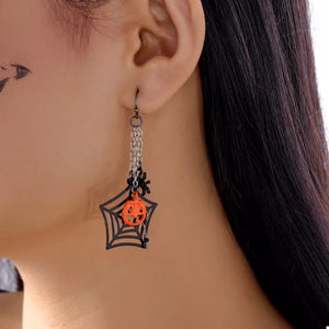 orange earrings featuring dangle and novelty