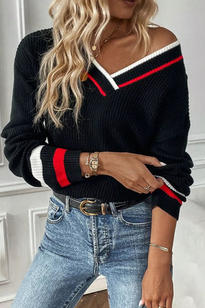 Black V-neck sweater with red and white striped trim on neckline and cuffs.