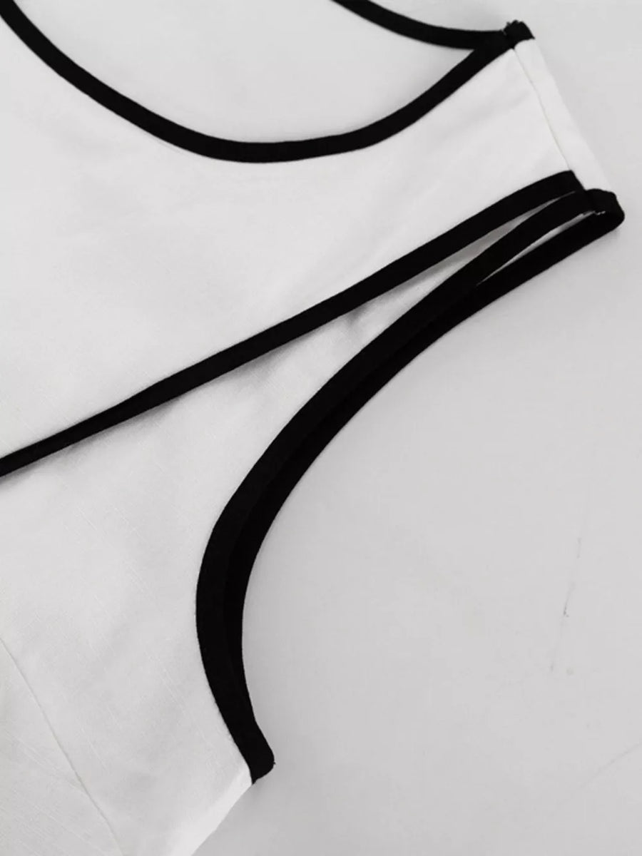 White tank top with black trim and thin straps