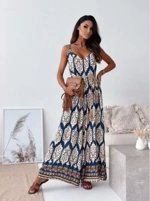 Paisley patterned wide-leg romper in Peacock Blue with a tied waist and tassel details.