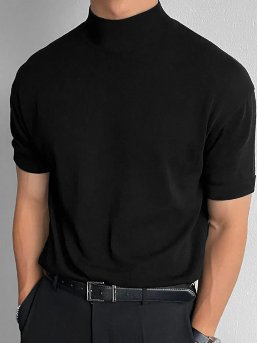 Black mock neck knit tee with rolled short sleeves.