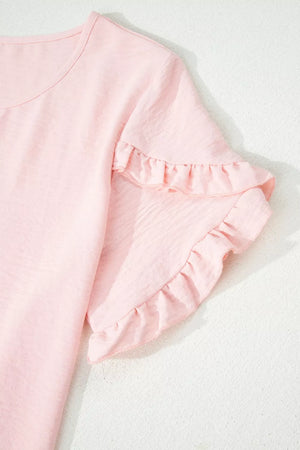 Blush pink polyester blouse with short ruffled sleeves and a crew neck.