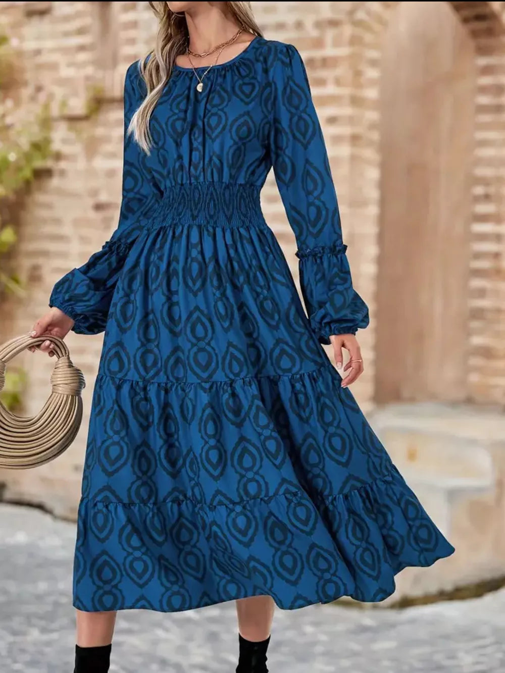 Blue abstract pattern midi dress with smocked waist, balloon sleeves and tiered skirt.