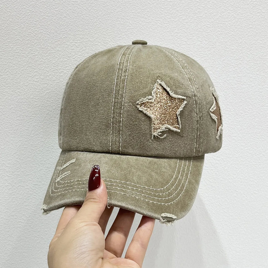 Khaki baseball cap with distressed stars and frayed brim.