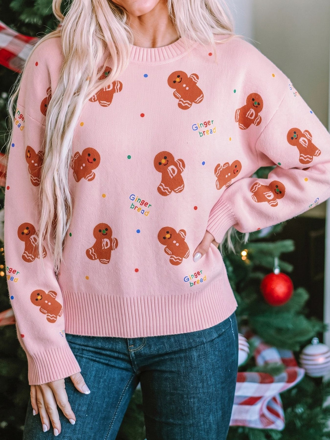 blush pink pullover sweater with gingerbread pattern and crew neck