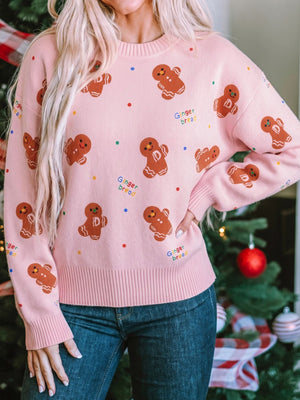 blush pink pullover sweater with gingerbread pattern and crew neck