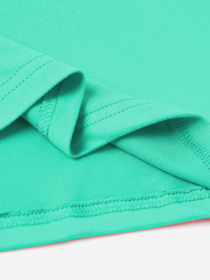 Aqua t-shirt detail showing hem stitching and fabric texture.