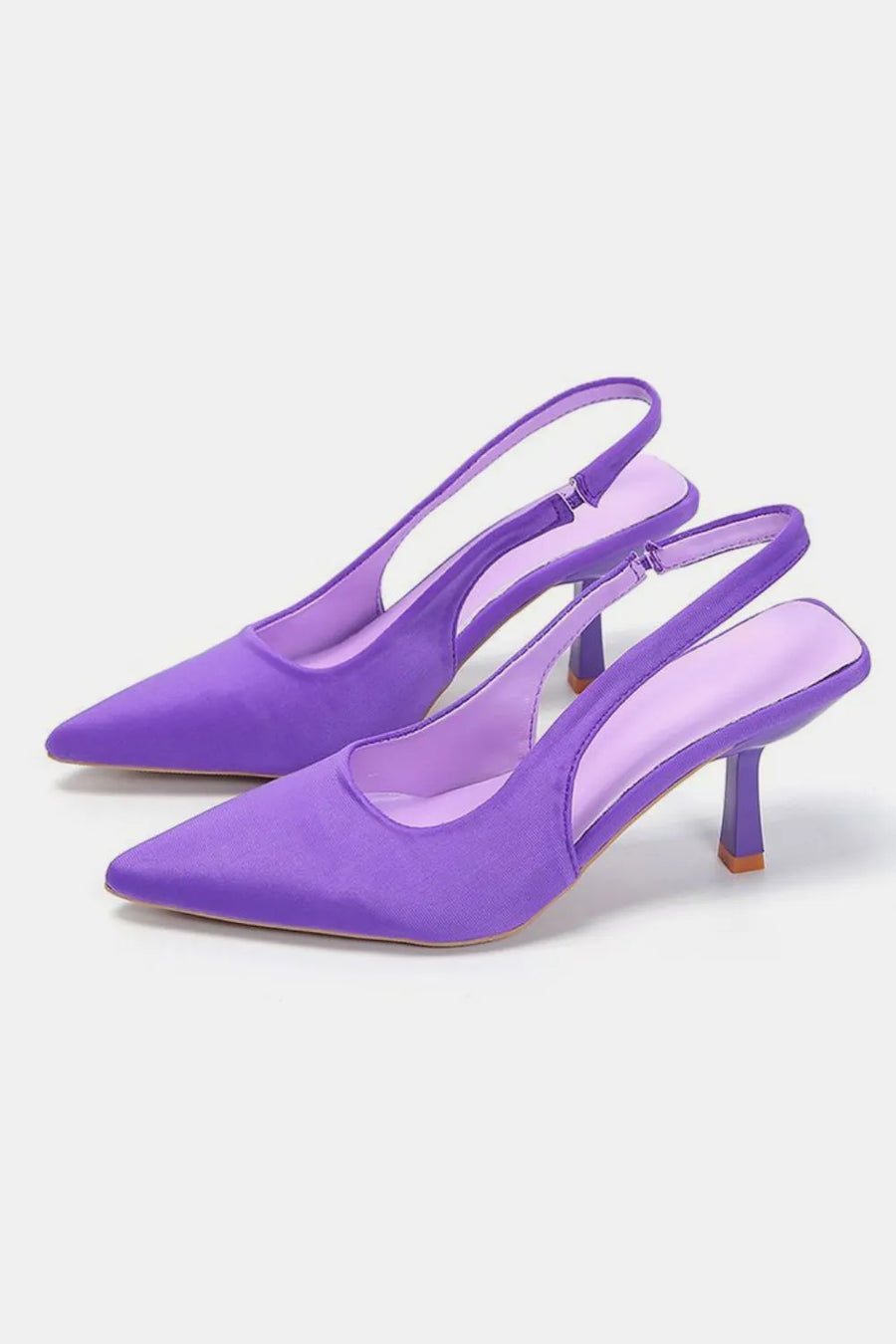 Vivid Violet satin slingback pumps with sculpted heels and pointed toes.