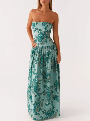 Turquoise strapless maxi dress with green floral print and gathered skirt.