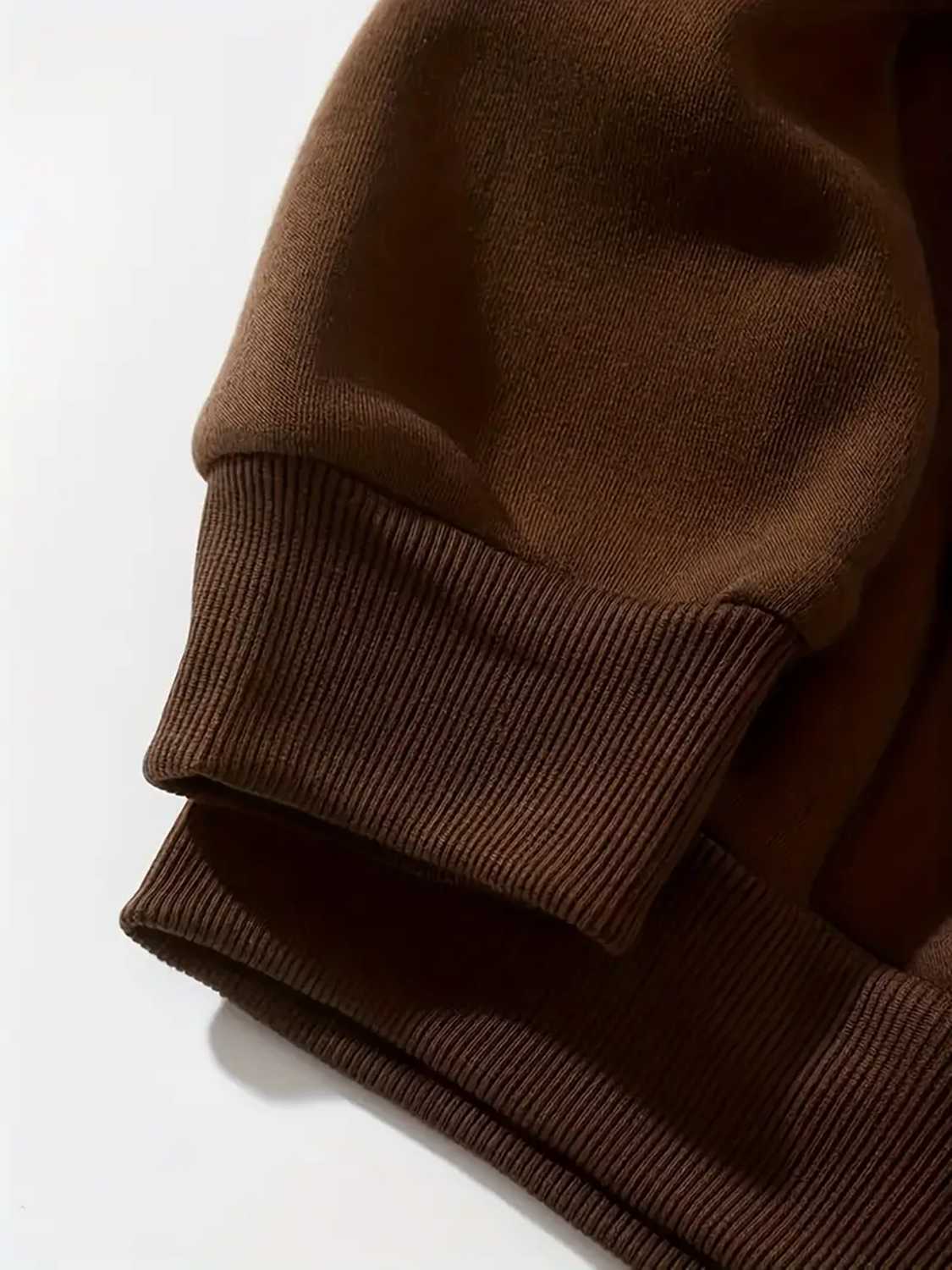 Chestnut brown hoodie with ribbed cuffs and hem detail.